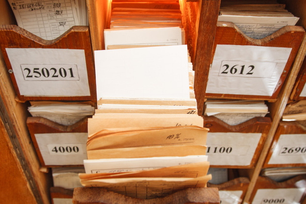 Paper documents stacked in archive - Foto, afbeelding