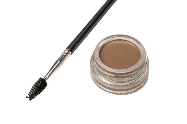 A brow pomade in blonde shade with brush isolated on a white background. Make up.  - 写真・画像