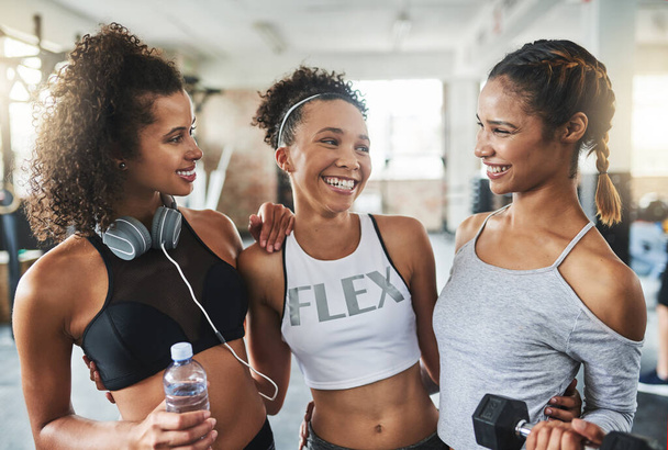 Workout together, win together. a group of happy young women enjoying their time together at the gym - Foto, Imagem