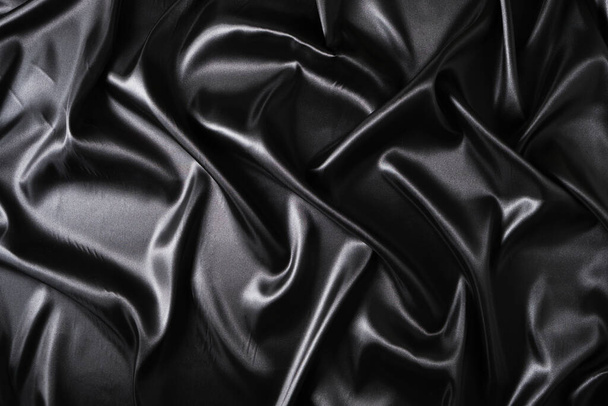 Silk fabric, abstract wavy black satin fabric background - Фото, зображення