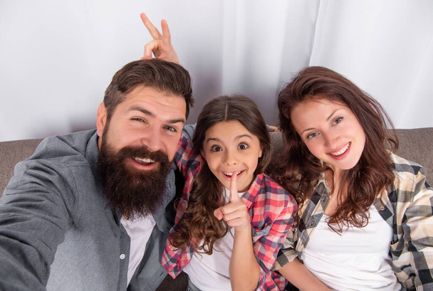 happy family make selfie sitting on sofa at home, family weekend. - Φωτογραφία, εικόνα