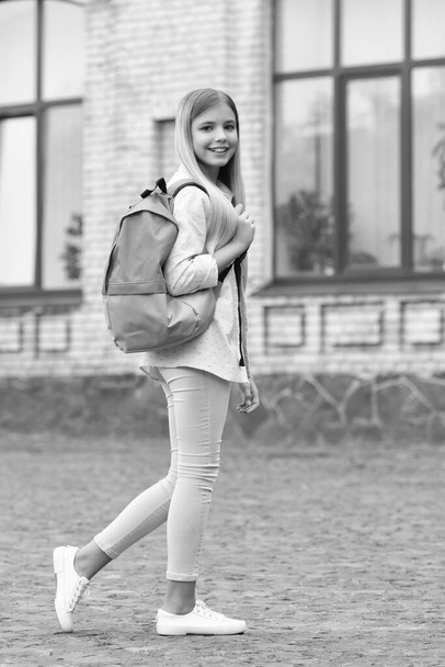 Happy girl going to school. Teenage girl back to school. September 1. School education. Back-to-school. - Photo, image