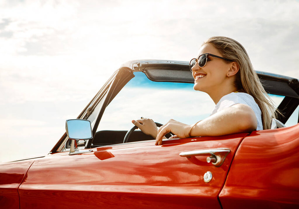 Nothing ventured, nothing gained. a happy young woman enjoying a summers road trip - Photo, Image