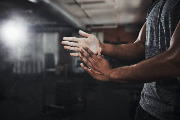 The power is in your hands. an unrecognizable man dusting his hands with talcum powder - 写真・画像