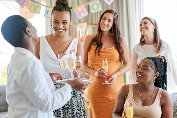 Lets get this party started. a group of female friends toasting to their pregnant friend at a baby shower - Fotó, kép
