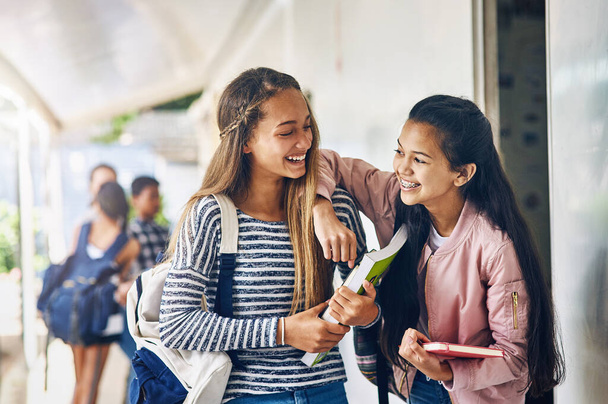 Girl friends, student and school with laughing and books with smile on campus. Teenager, young teen and girls with happiness and discussion together with education ready to start class and learning. - Photo, Image
