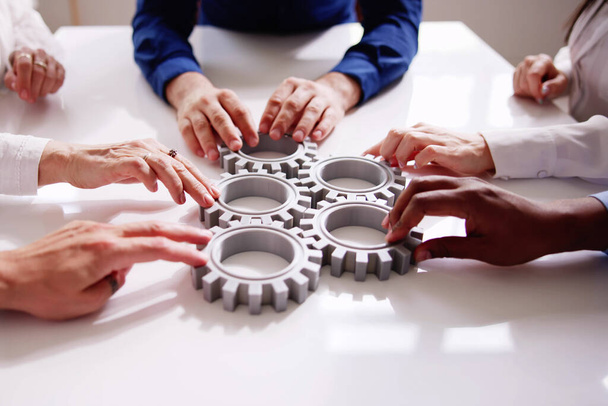 Diverse People Hands Holding Gear Wheels. Business Partnership - Foto, afbeelding