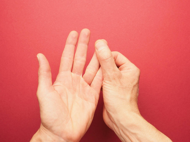 Hand position for mudra no. 3 in Jin Shin Jyutsu, alternative healing method or self-help concept, Asian medicine, awareness raising - Foto, Bild