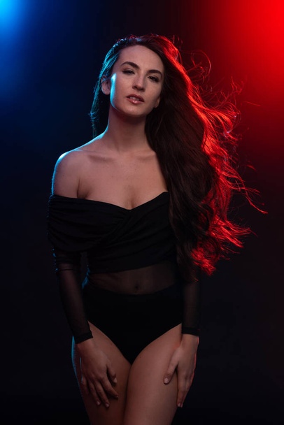 Sensual brunette woman portrait wearing black body. Colorful gel photography. - Fotoğraf, Görsel