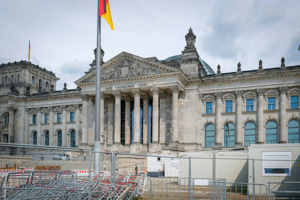 Berlin, Germany - May 15, 2023: Reichstag building and reconstruction works, seat of the German Parliament, Deutscher Bundestag, in Berlin, Germany. High quality photo - Фото, изображение