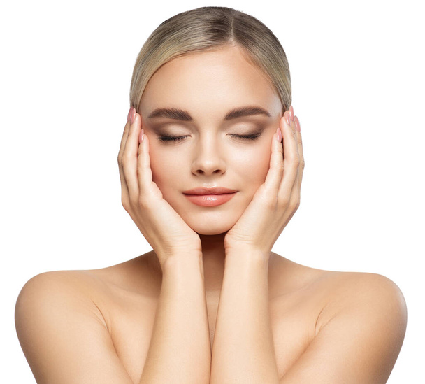 Woman Face Lifting Treatment. Women Facial and Body Skin Care. Beauty Model holding Head in Hands with Closed Eyes. Beautiful Girl Massage Face over White - Foto, imagen