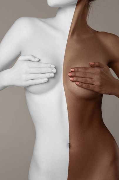 Faceless image of beautiful slim female body with tanned and white skin color against grey background. Female health care. Concept of body and skin care, spf protection, cosmetics, beauty - Foto, immagini