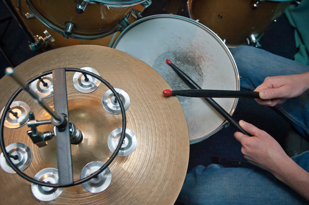 The drummer in action. A photo close up process play on a musical instrument - Foto, Imagen
