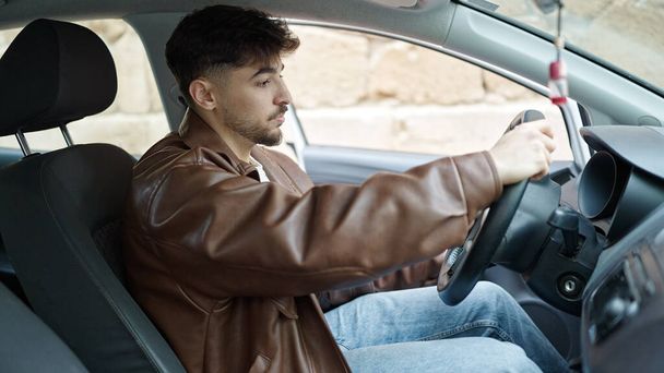 Young arab man driving car at street - Foto, Imagem