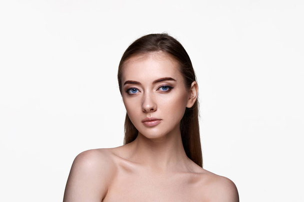 portrait of beautiful young woman with perfect skin on white background. - Φωτογραφία, εικόνα