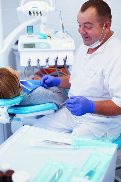 Doctor and patient in the dental clinic. - Photo, image