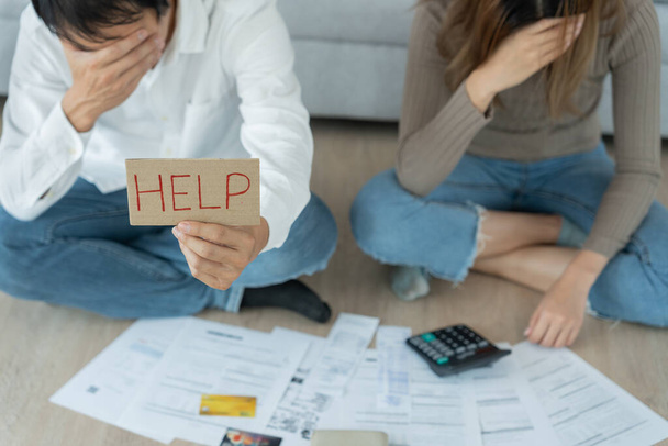 Stressed and headache asian couple with large bills or invoices no money to pay to expenses and credit card debt. shortage, Financial problems, mortgage, loan, bankruptcy, bankrupt, poor, empty wallet - Photo, image
