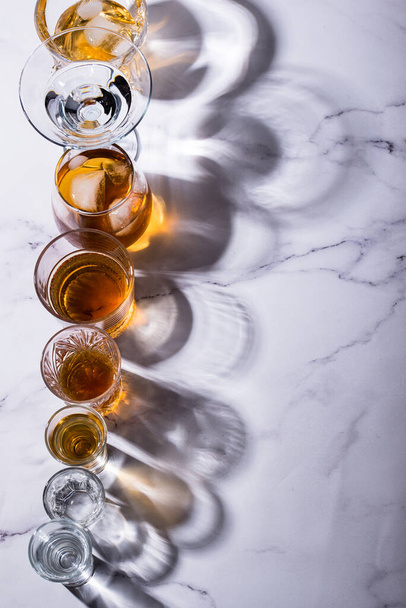 Assortment of strong alcohol drinks. Cognac, scotch, whiskey, tequila, vodka - Foto, Imagem
