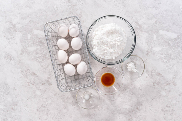 Flat lay. Ingredients for preparing unicorn theme meringue pops on the counter. - Foto, Imagem