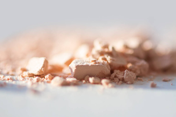 Broken cosmetic product on white close-up. - Foto, immagini
