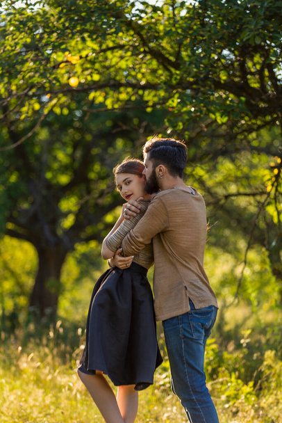 man hugging his girlfriend in nature - Fotó, kép