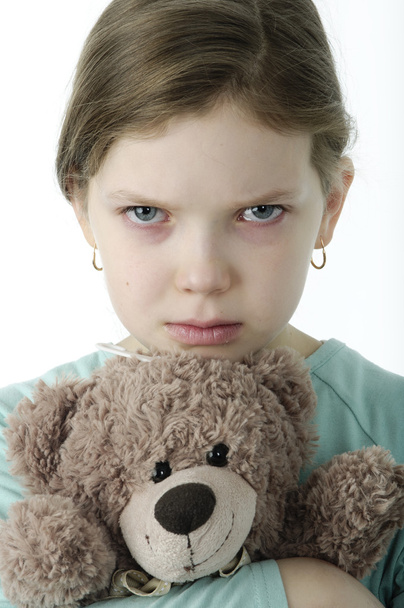 Portrait of  little girls cry holding teddy bear on white - Foto, Bild