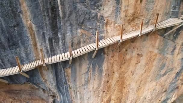 Panoramic beautiful vertiginous impressive aerial view of top to bottom of wooden staircase at rock cliff as part of hiking path in Congost de Montrebei gorge in Catalonia in Pyrenees,Spain.4K video - Footage, Video