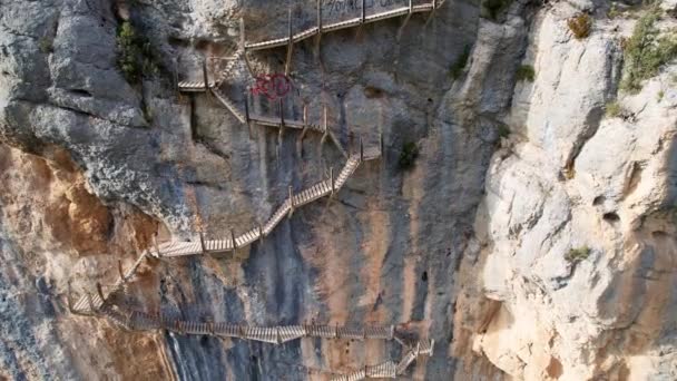 Panoramic beautiful vertiginous impressive aerial view of top to bottom of wooden staircase at rock cliff as part of hiking path in Congost de Montrebei gorge in Catalonia in Pyrenees,Spain.4K video - Footage, Video