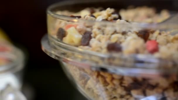Breakfast - cereals - müsli in bowl - Materiał filmowy, wideo