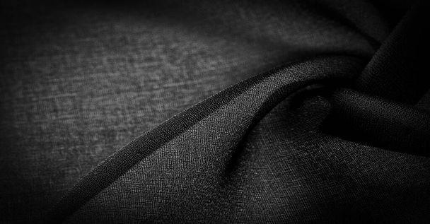 Ciemnoczarny jedwab szyfonowy to miękka przezroczysta tkanina o lekkiej chropowatości (matowa, krepowana) dzięki zastosowaniu skręconej przędzy. Tekstura tła - Zdjęcie, obraz