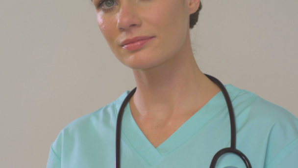 Portrait of female doctor with stethoscope - Кадры, видео