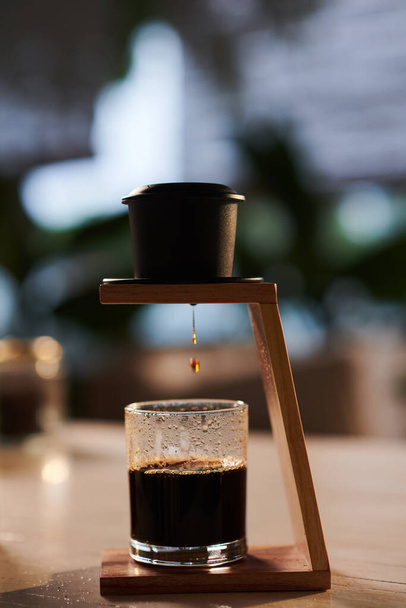 Phin filter for making Vietnamese style coffee on table in coffeeshop - Photo, Image
