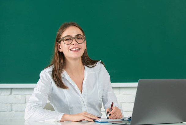 Female student on lesson lecture in classroom at high school or college, online learning at school, distance education - Фото, изображение