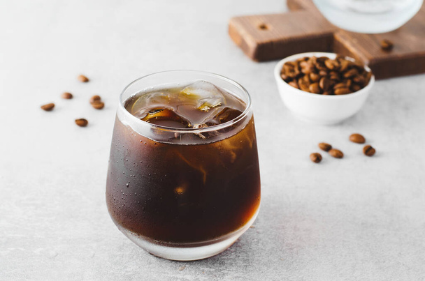 Iced Coffee, Cold Brew Coffee with Ice on Bright Light Grey Background, Refreshing Beverage - Photo, Image