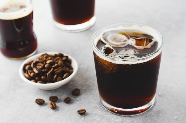 Iced Coffee, Sparkling or Cold Brew Coffee with Ice on Bright Light Grey Background, Refreshing Beverage - Photo, Image