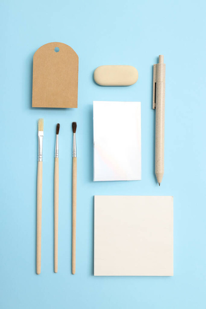 Mockup flat lay with different office accessories on blue background - Фото, изображение