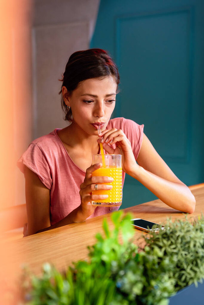 Portrait of beautiful fit woman drinking organic healthy smoothie. People healthy lifestyle body care concept. - Photo, image