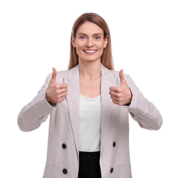 Beautiful happy businesswoman showing thumbs up on white background - Фото, зображення