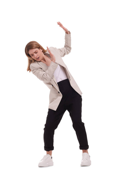 Beautiful businesswoman avoiding something on white background - Фото, зображення