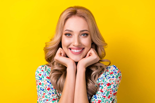 Portrait of cheerful sweet perfect lady curly hairdo two arm under chin waiting sale rejoice shopping isolated on yellow color background. - Foto, afbeelding