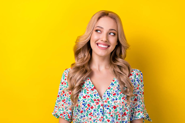 Photo of adorable cute nice lady dressed bright clothes looking empty space interesting proposition isolated on yellow color background. - Foto, afbeelding