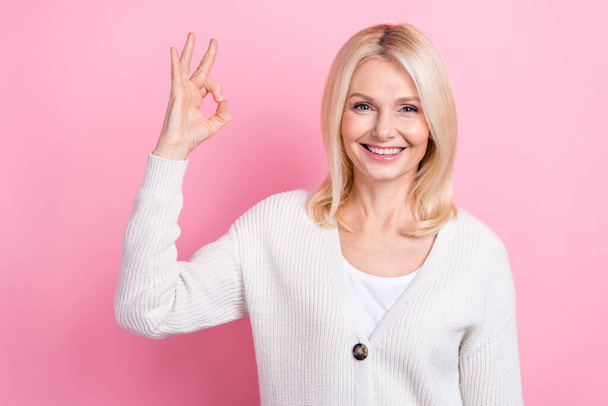 Portrait of nice lovely person toothy smile hand fingers demonstrate okey symbol isolated on pink color background. - Zdjęcie, obraz