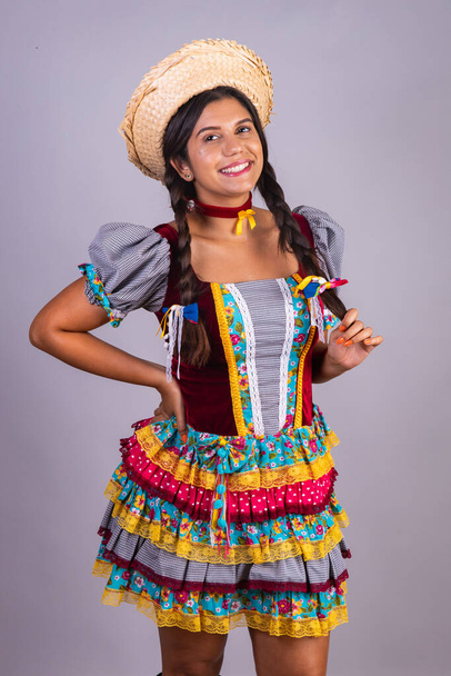 Brazilian woman, clothes from festa junina, arraial, festa de so joo. Vertical portrait - 写真・画像