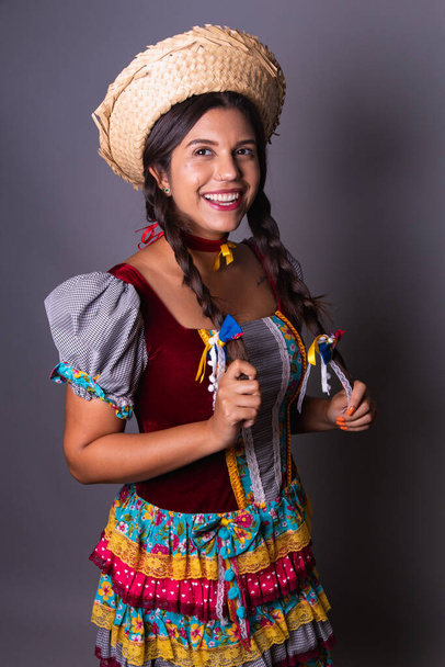 Brazilian woman, clothes from festa junina, arraial, festa de so joo. Vertical portrait - Фото, изображение