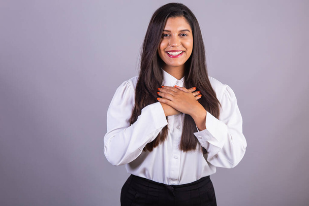 Brazilian businesswoman, manager, corporate portrait. hands on chest gratitude. - Φωτογραφία, εικόνα