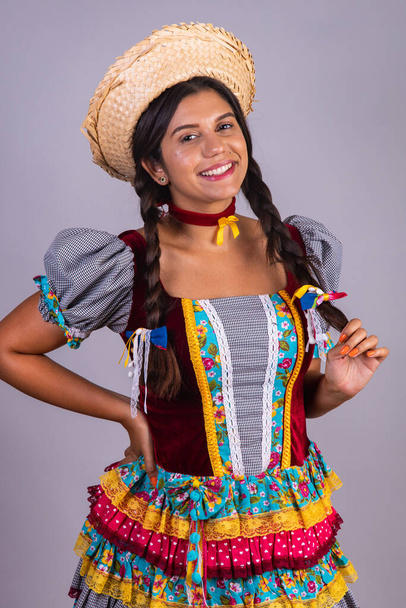 Brazilian woman, clothes from festa junina, arraial, festa de so joo. Vertical portrait - Zdjęcie, obraz