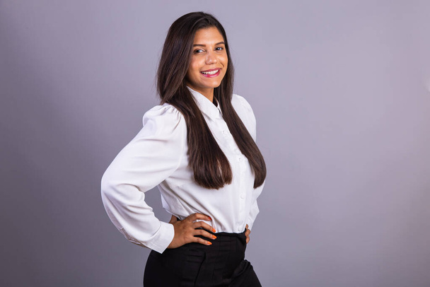 Brazilian businesswoman, manager, corporate portrait. hands on waist. - Fotó, kép