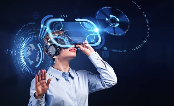 Businesswoman working in vr glasses, hand touch digital hologram with glowing hud with digital connection. Concept of metaverse and technology - Fotó, kép
