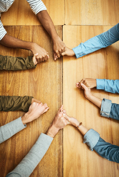 Hands holding, support and people planning together for prayer circle, love and care in a team building table. Above, community and group teamwork by employees with hope, collaboration and help. - Fotoğraf, Görsel