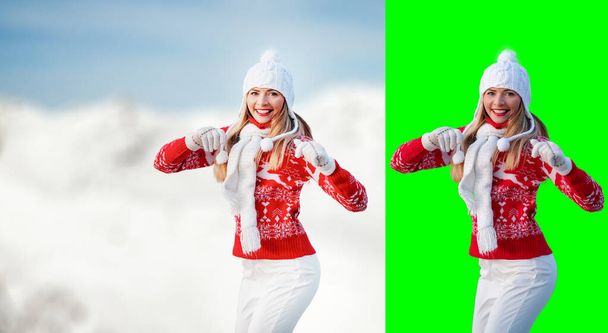Young woman wear red winter pullover, white hat, smiling, hands in air, blurred snow country background, free space for text left side, isolated selection on green background included - Photo, image